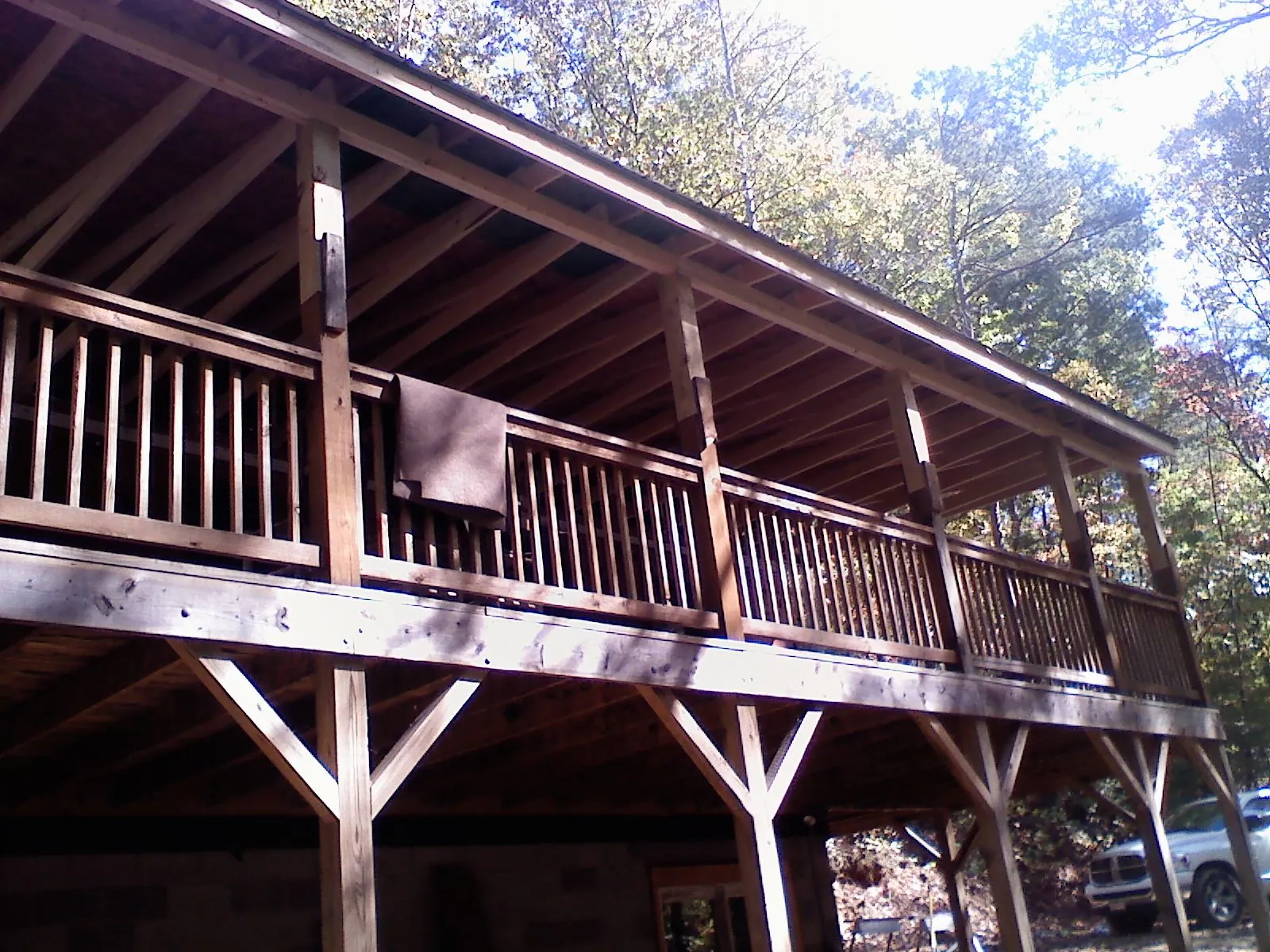 Timber framing under a new elevated porch and deck — Roof Leak Repair in Middleboro by Roofing Brothers